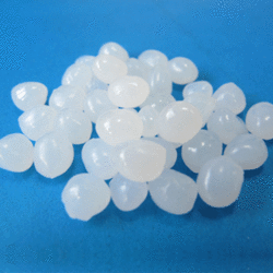 White translucent beads on a blue background.