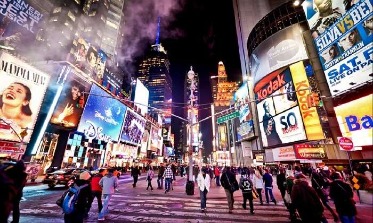Times Square, NYC, bustling nightlife scene.