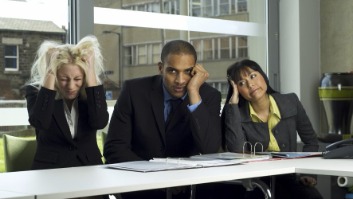 Frustrated professionals in a meeting.