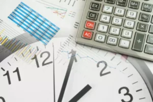 Clock, calculator, and financial charts layout.