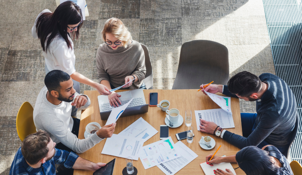 A group of people sitting around a table.