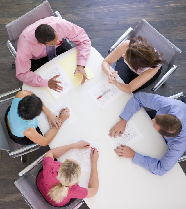 Team collaborating around a conference table.